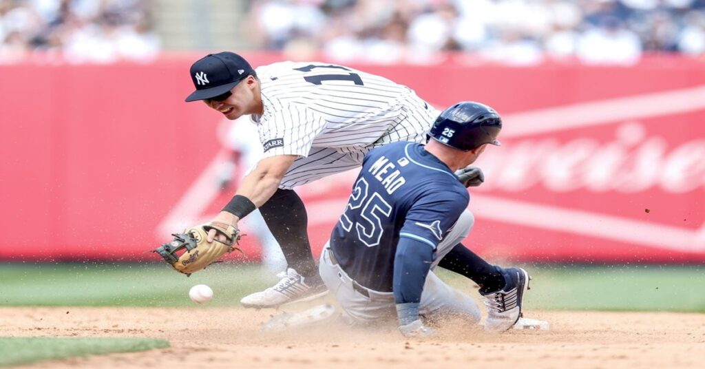En la foto, Una jugada del partido entre Rays y Yankees
