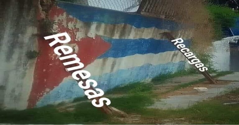 En la foto, una bandera cubana en una pared que se cae