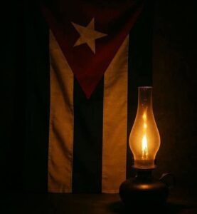 En la foto, una bandera cubana y un quinqué en la penumbra