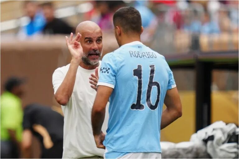 En la foto, Pep Guardiola y Rodri