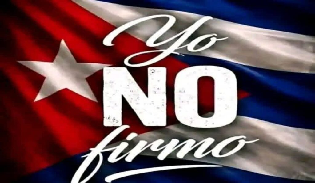 En la foto, una imagen con un letrero que dice "Yo no firmo"