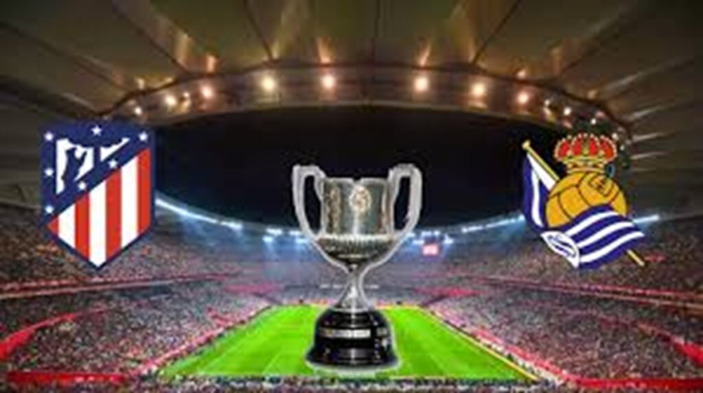 En la foto, escudos del Atlético y la Real Soiedad escoltan la Copa del Rey