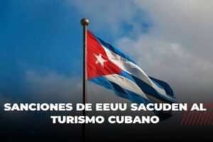 En la foto, una bandera cubana y el anuncio de las sanciones