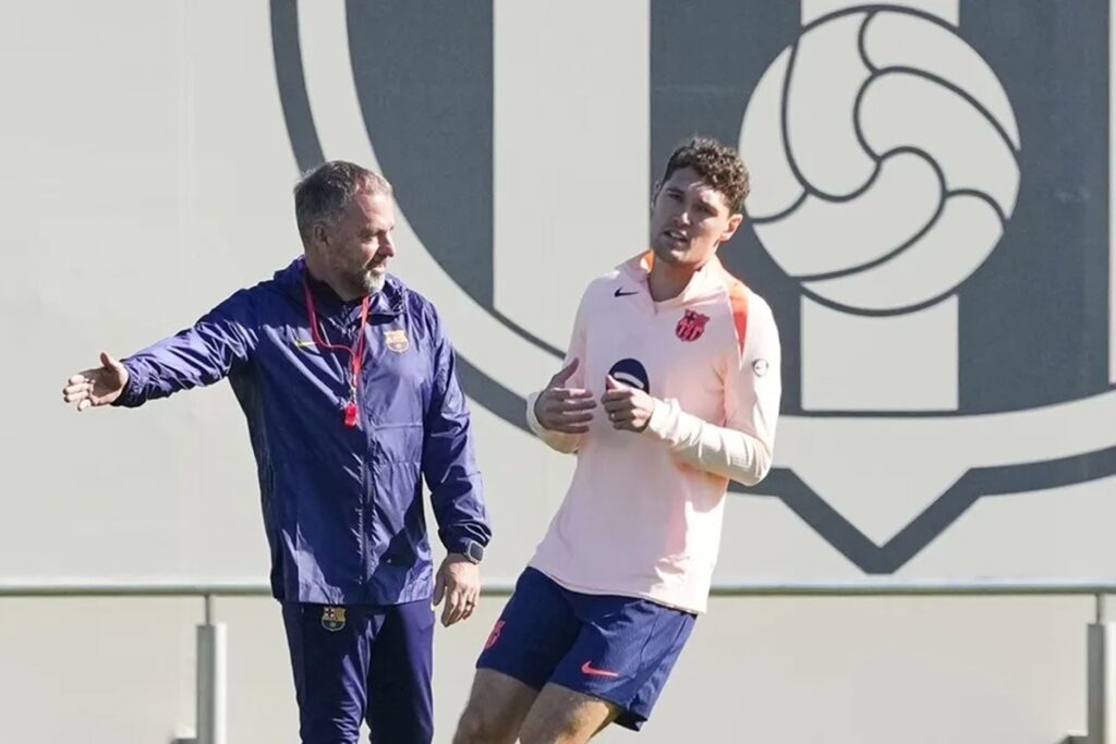 En la foto, El entrenador del FC Barcelona, Hansi Flick, y el jugador Andreas Christensen